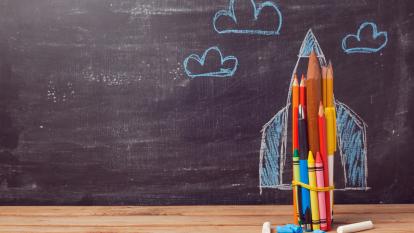 Back to school background with rocket made from pencils